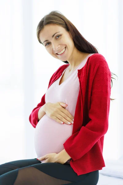 Pregnant Woman Sits Bed Her Bedroom Caressing Her Belly Happy — Stockfoto