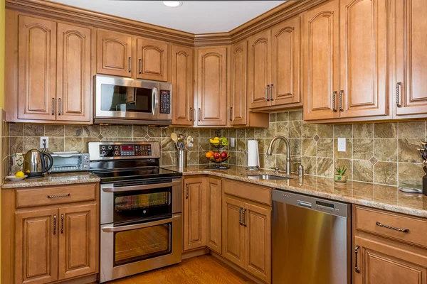 Kitchen mocha wood cabinetry — Stock Photo, Image