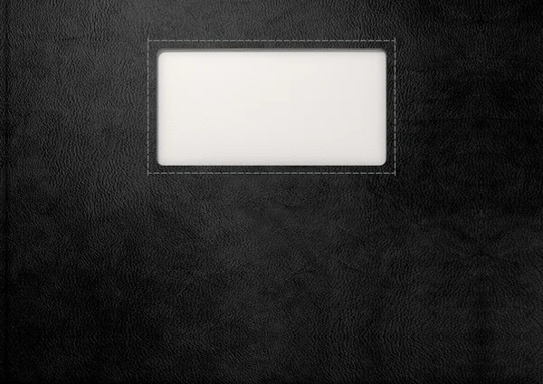 Schwarzes Leder mit eingelegtem Etikett — Stockfoto