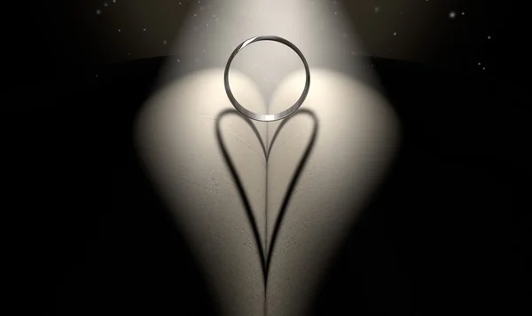 Кільце і тінь у формі серця — стокове фото