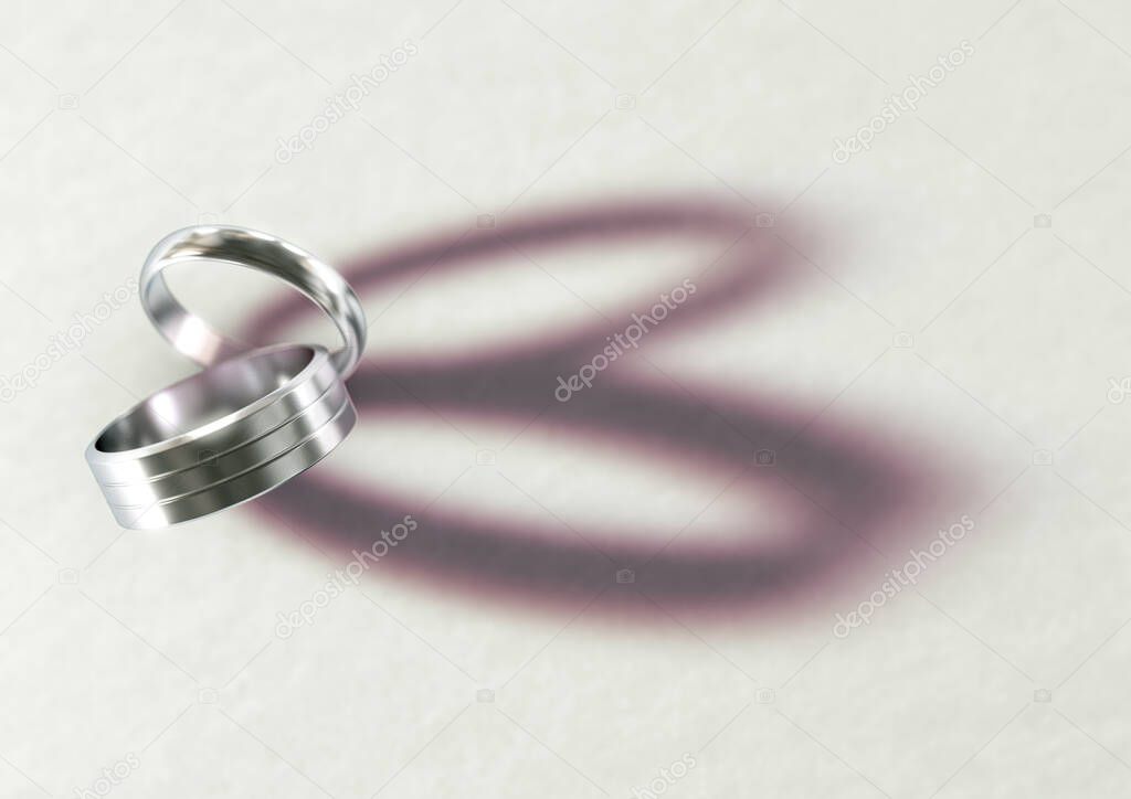 A pair of white wedding rings resting on an isolated white suface casting a shape resembling a heart - 3D render