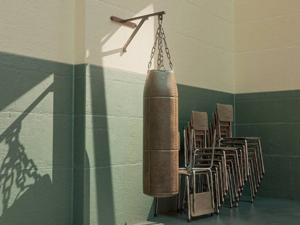 Old Vintage Leather Punching Bag Mounted Green Wall Room Stacked 免版税图库照片