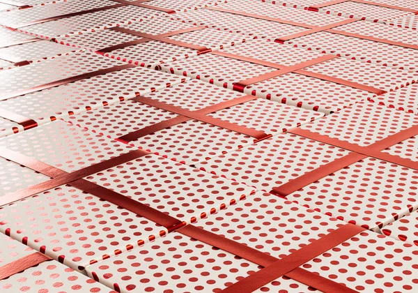 A collection of different sized rectangular gift boxes wrapped in polka dot red gift wrap paper with a red ribbon laid out flat on an isolated studio background - 3D render