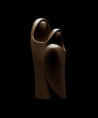 An abstract stylized wood carving depicting a christian christmas nativity scene featuring mary, joseph and baby jesus - 3D render