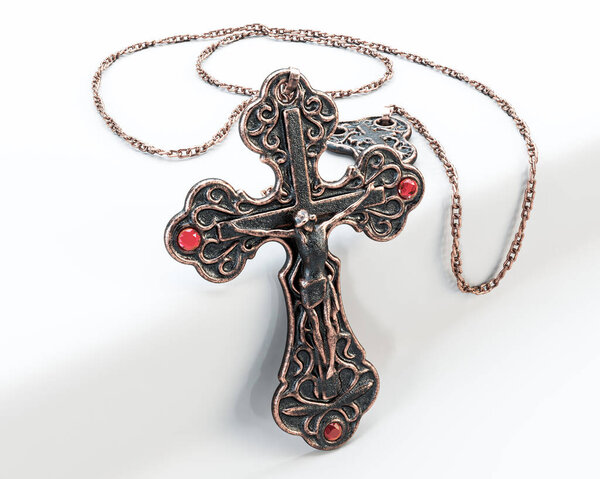 A closeup of an ornate brass antique rosary chain necklace with a crucifix draped on an isolated white background - 3D render