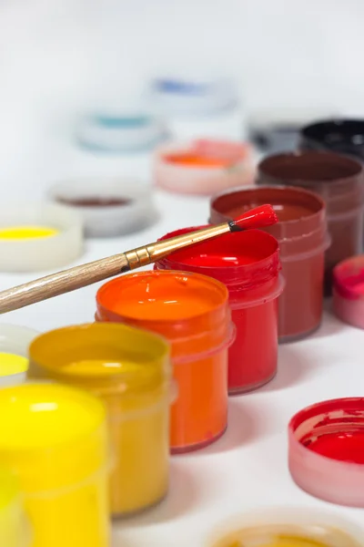 Paint and brushes — Stock Photo, Image