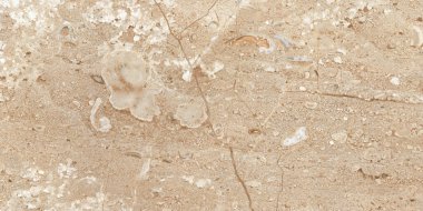 Dokulu arka plan. Dekoratif alçı duvarlar, dış cephe dekorasyonu. Bej rengi.