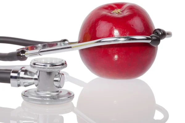 Stethoscope and apple — Stock Photo, Image