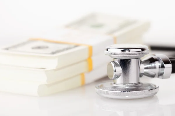 Stethoscope and dollars — Stock Photo, Image