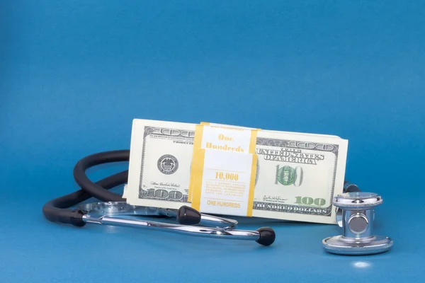 Stethoscope and dollars — Stock Photo, Image