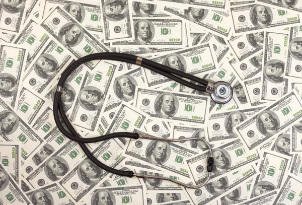 Stethoscope and dollars — Stock Photo, Image