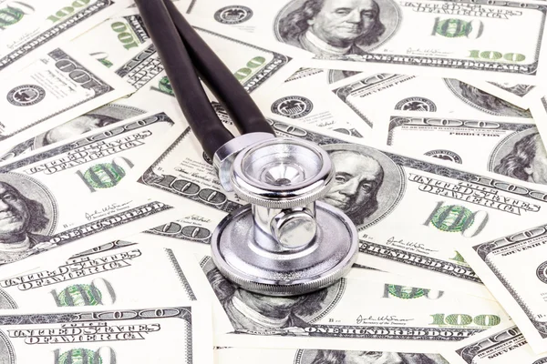 Stethoscope and dollars — Stock Photo, Image