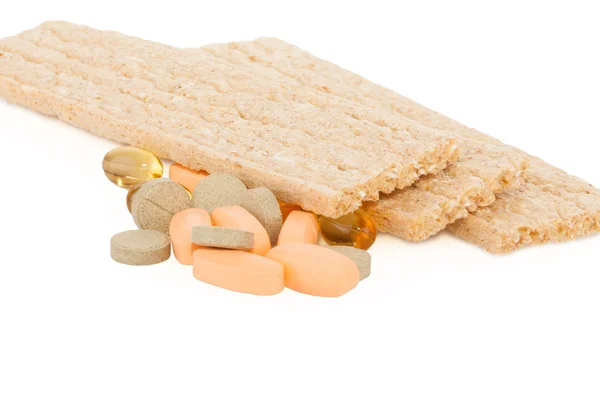 Smakelijke knäckebröd en tabletten — Stockfoto