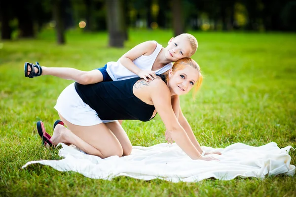 Little boy having fun with his mother — Stock Photo, Image