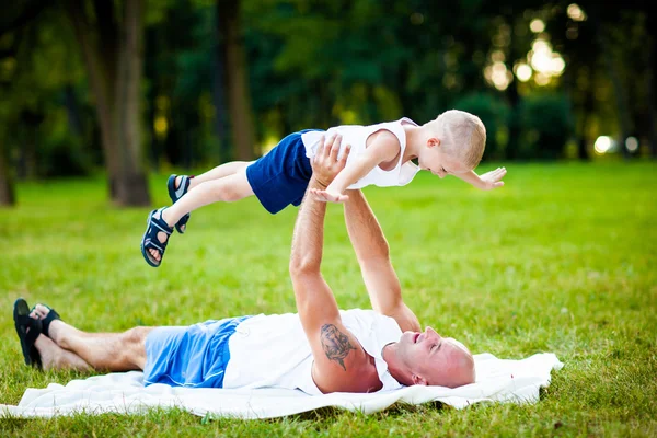 Father and child having fun in park — Stock Photo, Image