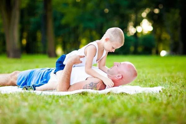 Father and child having fun in park — Stock Photo, Image