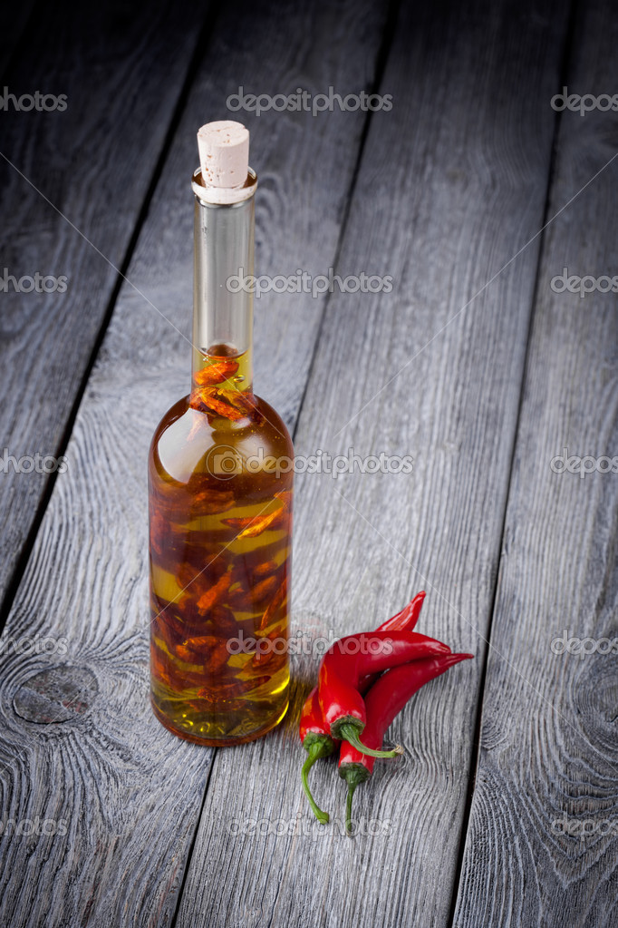 Natural diy infused olive oil with chili Stock Photo by ©annabieniek