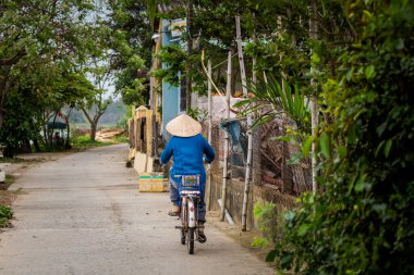 Beautiful local people among oriental architecture of Vietnam taken in Hoi An