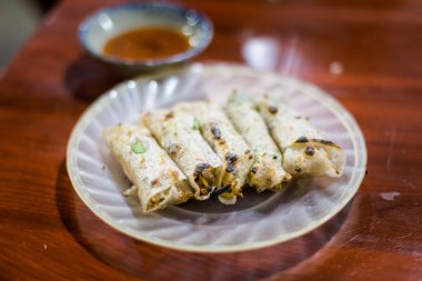 Delicious spring rolls Nem Choun. Traditional vietnamese cuisine served in restaurant in Hoi An, Vietnam.