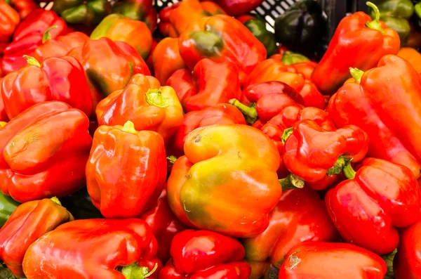 Red bell peppers on display — Stock Photo, Image