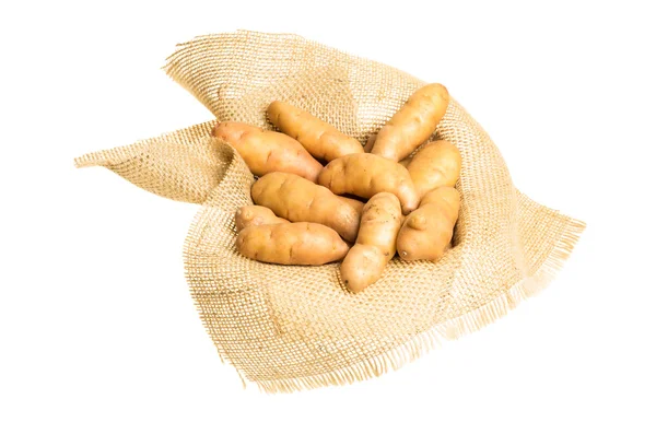 Fingerling potatoes on burlap isolated — Stock Photo, Image