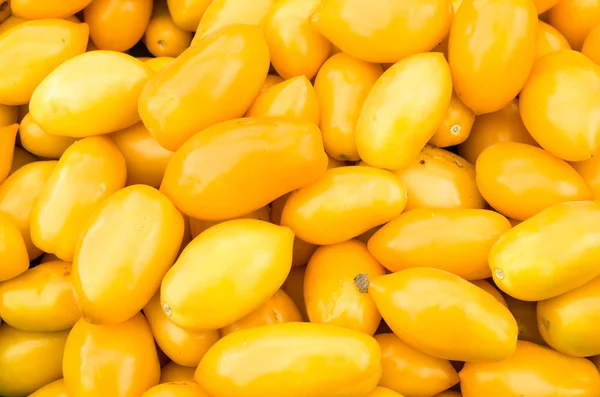 Yellow pear tomatoes on display — Stock Photo, Image