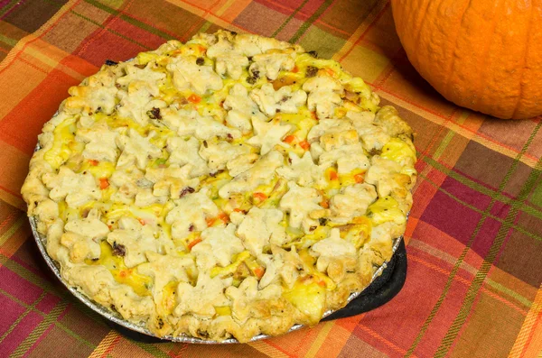 Turkey pot pie with pumpkin on table — Stock Photo, Image