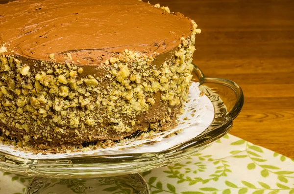 Chocolate cake on glass server — Stock Photo, Image