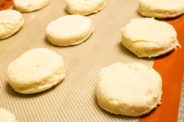 Biscuits on baking sheet — Stock Photo, Image