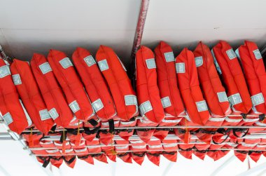 Life preservers racked on a ship clipart