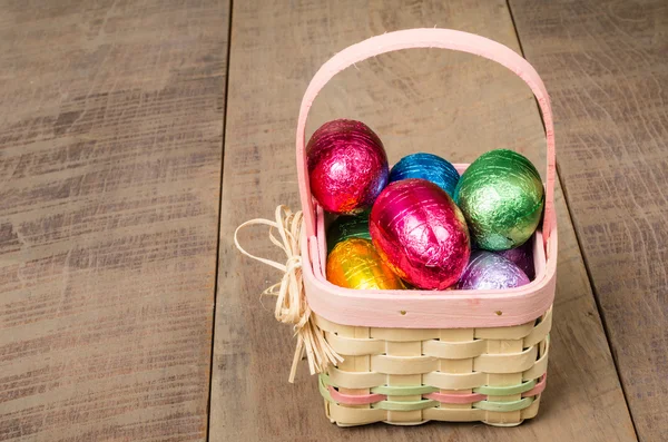 Wicker Easter basket with foil eggs — Stock Photo, Image