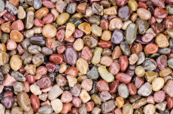 Shiny stones or pebbles for use as a background — Stock Photo, Image