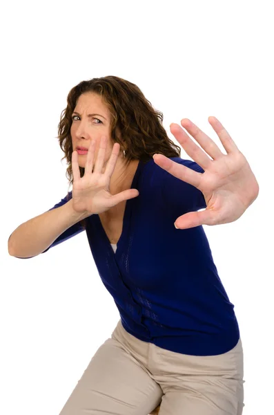 Middle aged woman defending herself — Stock Photo, Image