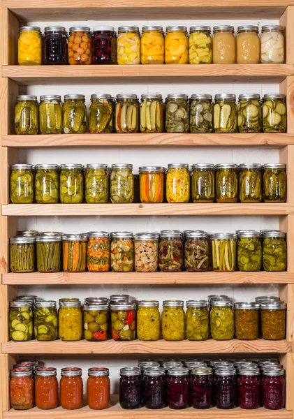 Storage shelves with canned food — Stock Photo, Image