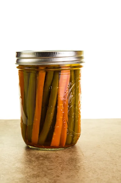 Preserved beans and carrots in a jar — Stock Photo, Image