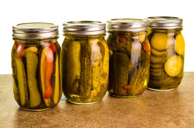 Homemade pickles in mason jars clipart