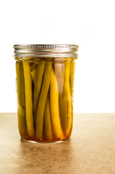 Jar of preserved green and yellow beans — Stock Photo, Image