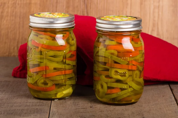 Hot pepper slices canned in mason jars — Stock Photo, Image