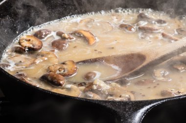 Making mushroom gravy or rue clipart