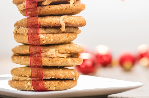 Stack of Christmas Cookies tied with red ribbon — Stock Photo, Image