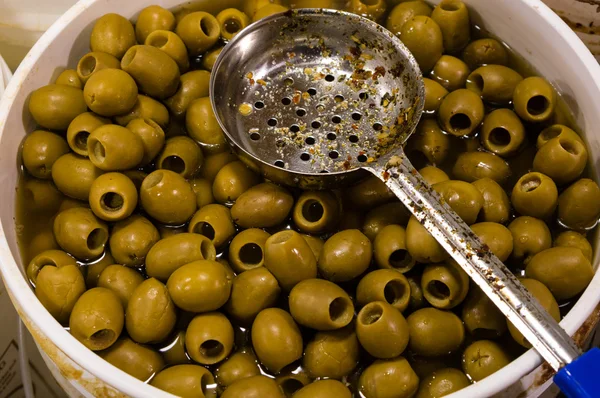 Bucket of olives in a grocery — Stock Photo, Image