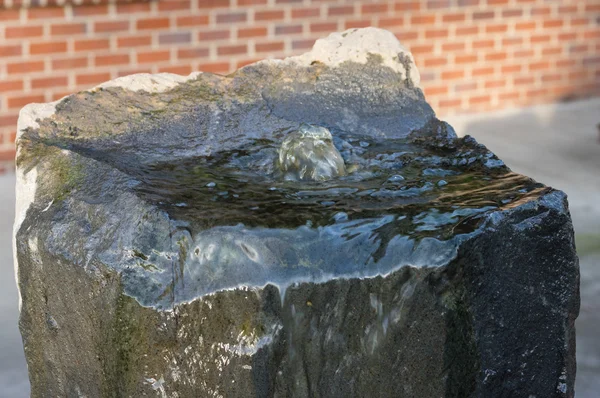 Bubbling water fountain in a landscape — Stock Photo, Image