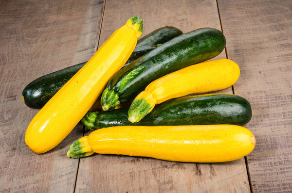 Zucchini and yellow squash on table