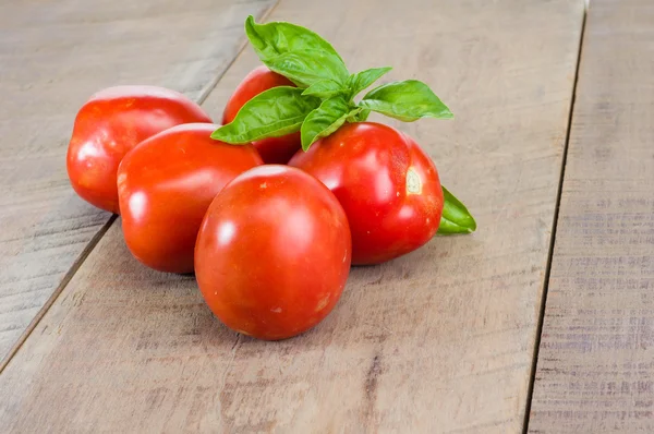 Red paste tomatoes on a wooden table — Stock Photo, Image