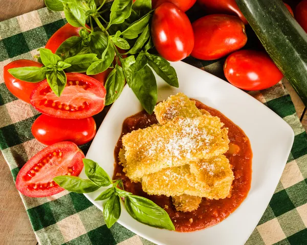 Zucchini Parmesan dinner with basil — Stock Photo, Image