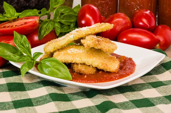 Zucchini Parmesan dinner with basil — Stock Photo, Image