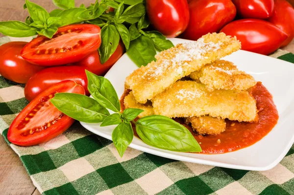 Zucchini Parmesan dinner with basil — Stock Photo, Image