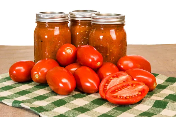 Jars of tomato sauce with paste tomatoes — Stock Photo, Image