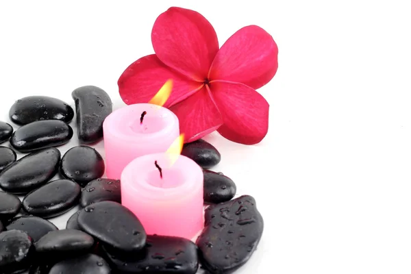 Zen stones with red frangipani flower, cancle and text space on — Stock Photo, Image