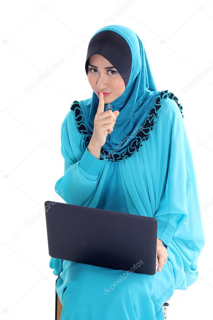 Muslim Businesswoman making a keep it quiet sign with his hand